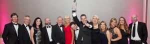 Callan Tansey team winner of Irish Law Awards & Roger Murray holding up medal