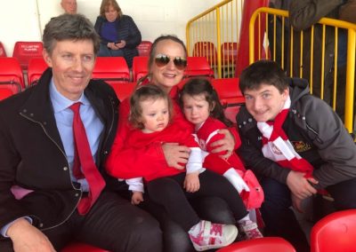 Callan Tansey staff members with children at Sligo Rovers game
