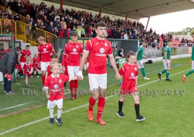 Sligo Rovers team members coming out on pitch with mascots